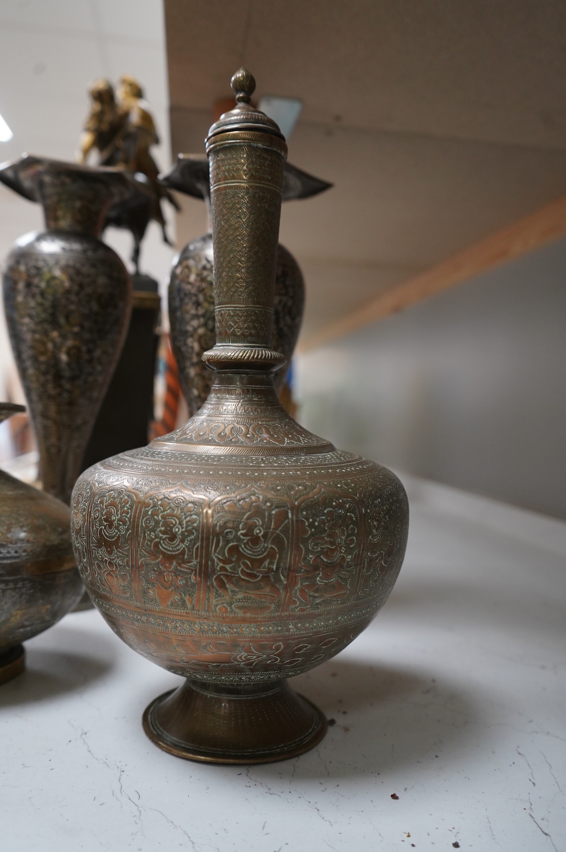 A collection of Indian brass and metalware to include a pierced casket box and Bidriware vases, largest 33cm high